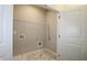 Laundry room with built-in shelving and vinyl flooring at 2920 Ilir Nw Mnr, Atlanta, GA 30318