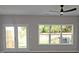 Bright living room with double doors leading to the backyard and large windows at 2920 Ilir Nw Mnr, Atlanta, GA 30318