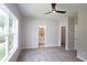 Main bedroom with private bathroom, walk-in closet, and large windows at 2920 Ilir Nw Mnr, Atlanta, GA 30318