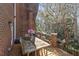 Relaxing deck with wooden table and chairs, overlooking wooded area at 105 Jefferson Ne Cir, Atlanta, GA 30328