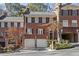 Brick front exterior of charming townhome with two-car garage at 105 Jefferson Ne Cir, Atlanta, GA 30328