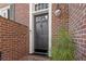 Elegant black front door with sidelights, welcoming entryway at 105 Jefferson Ne Cir, Atlanta, GA 30328