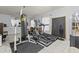 Home gym with multiple workout machines and a punching bag at 105 Jefferson Ne Cir, Atlanta, GA 30328