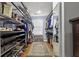 Spacious walk-in closet with shelving and rod for hanging clothes at 105 Jefferson Ne Cir, Atlanta, GA 30328