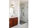 Modern bathroom featuring a walk-in shower and dark wood vanity at 1870 Vigo Ne St, Atlanta, GA 30307