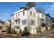 Modern white three-story home with a detached garage at 1870 Vigo Ne St, Atlanta, GA 30307