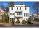 White two-story home with a front balcony and landscaping at 1870 Vigo Ne St, Atlanta, GA 30307