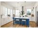 Modern kitchen with white cabinets and a blue island at 1870 Vigo Ne St, Atlanta, GA 30307