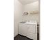 Convenient laundry room with washer, dryer, and overhead shelving at 1870 Vigo Ne St, Atlanta, GA 30307