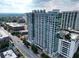 An aerial view of a high-rise condominium showcasing its modern architecture and surrounding cityscape at 250 Pharr Ne Rd # 716, Atlanta, GA 30305