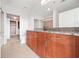 Bathroom featuring wooden cabinets, a granite countertop, and a large mirror, offering storage and style at 250 Pharr Ne Rd # 716, Atlanta, GA 30305