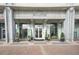 Building exterior showcasing a stylish entrance with manicured greenery, creating a welcoming atmosphere at 250 Pharr Ne Rd # 716, Atlanta, GA 30305