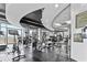 A full gym with stationary bikes, weight machines and large windows with city views at 250 Pharr Ne Rd # 716, Atlanta, GA 30305