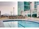 Rooftop pool featuring city views, lounge chairs and clear blue water at 250 Pharr Ne Rd # 716, Atlanta, GA 30305