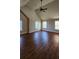 Large bedroom with high ceilings, wood flooring, and ceiling fan at 416 Culloden Moor Dr, Mcdonough, GA 30253