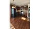 Spacious kitchen with dark wood cabinets and hardwood floors at 416 Culloden Moor Dr, Mcdonough, GA 30253