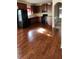 Spacious kitchen with dark wood cabinets and hardwood floors at 416 Culloden Moor Dr, Mcdonough, GA 30253