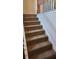 Stairs with neutral-toned carpet runner at 416 Culloden Moor Dr, Mcdonough, GA 30253