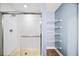 Bathroom with walk-in shower and storage shelves at 563 Memorial Se Dr # 405, Atlanta, GA 30312