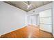 Hardwood floor bedroom with exposed ceiling and fan at 563 Memorial Se Dr # 405, Atlanta, GA 30312