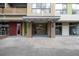 Exterior shot of building entrance featuring awning, brick pillars, and glass doors providing an open and accessible welcome at 563 Memorial Se Dr # 405, Atlanta, GA 30312