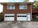 Brick home with attached two-car garage and deck at 363 Seminole Ne Dr, Marietta, GA 30060