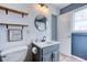 Bathroom features a toilet, vanity, and a mirror at 12524 Highway 36, Covington, GA 30014