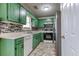 Eat-in kitchen with stone backsplash, tile floors, and stainless steel refrigerator at 12524 Highway 36, Covington, GA 30014