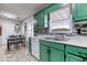 Kitchen area with wood cabinets, view of table, and stone backsplash at 12524 Highway 36, Covington, GA 30014