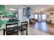 Open concept kitchen and living area with green cabinets and wood floors at 12524 Highway 36, Covington, GA 30014