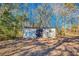 This shed is well placed in a wooded area at 12524 Highway 36, Covington, GA 30014