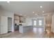 Open concept kitchen features island and stainless steel appliances at 148 Werner Brook Sw Way, Atlanta, GA 30354