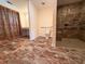 Large accessible bathroom with walk-in shower and neutral tile flooring at 1760 Marceau Dr, Conley, GA 30288