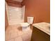 Bathroom with tub, toilet, and granite countertop at 1760 Marceau Dr, Conley, GA 30288