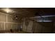Unfinished garage with overhead door and ample storage space at 1760 Marceau Dr, Conley, GA 30288