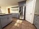 Modern kitchen with gray cabinets, granite countertops, and stainless steel appliances at 1760 Marceau Dr, Conley, GA 30288