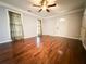 Living room with hardwood floors, neutral walls, and a ceiling fan at 1760 Marceau Dr, Conley, GA 30288