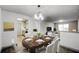 Dining area with table and chairs, open to living room and kitchen at 3102 Fairington Village Dr, Lithonia, GA 30038