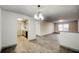 Open dining area with chandelier and view of kitchen at 3102 Fairington Village Dr, Lithonia, GA 30038