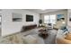 Living room with staged furniture and wood-look floors at 3102 Fairington Village Dr, Lithonia, GA 30038
