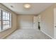 Bright bedroom with neutral walls and carpet at 591 Paper Ridge Ct, Lawrenceville, GA 30046