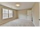 Bedroom with window and neutral wall color at 591 Paper Ridge Ct, Lawrenceville, GA 30046