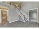 Two-story foyer with gray-tone wood-look floors and gray railing at 591 Paper Ridge Ct, Lawrenceville, GA 30046