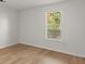 Simple bedroom with hardwood floors and a window at 2042 Brian Way, Decatur, GA 30033