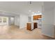 Open-concept kitchen has white appliances and a wood cabinet island at 2042 Brian Way, Decatur, GA 30033