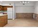 Eat-in kitchen featuring wooden cabinets, white appliances, and tiled flooring at 2042 Brian Way, Decatur, GA 30033