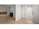 Bright living room featuring a fireplace and hardwood flooring with sliding door at 2042 Brian Way, Decatur, GA 30033