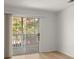 Living room with sliding glass door leading to a balcony at 2042 Brian Way, Decatur, GA 30033