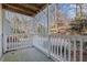 Outdoor patio with white railing and view of the surrounding trees at 2042 Brian Way, Decatur, GA 30033