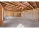 Unfinished basement with exposed framing and concrete floor at 2210 Cormac St, East Point, GA 30344